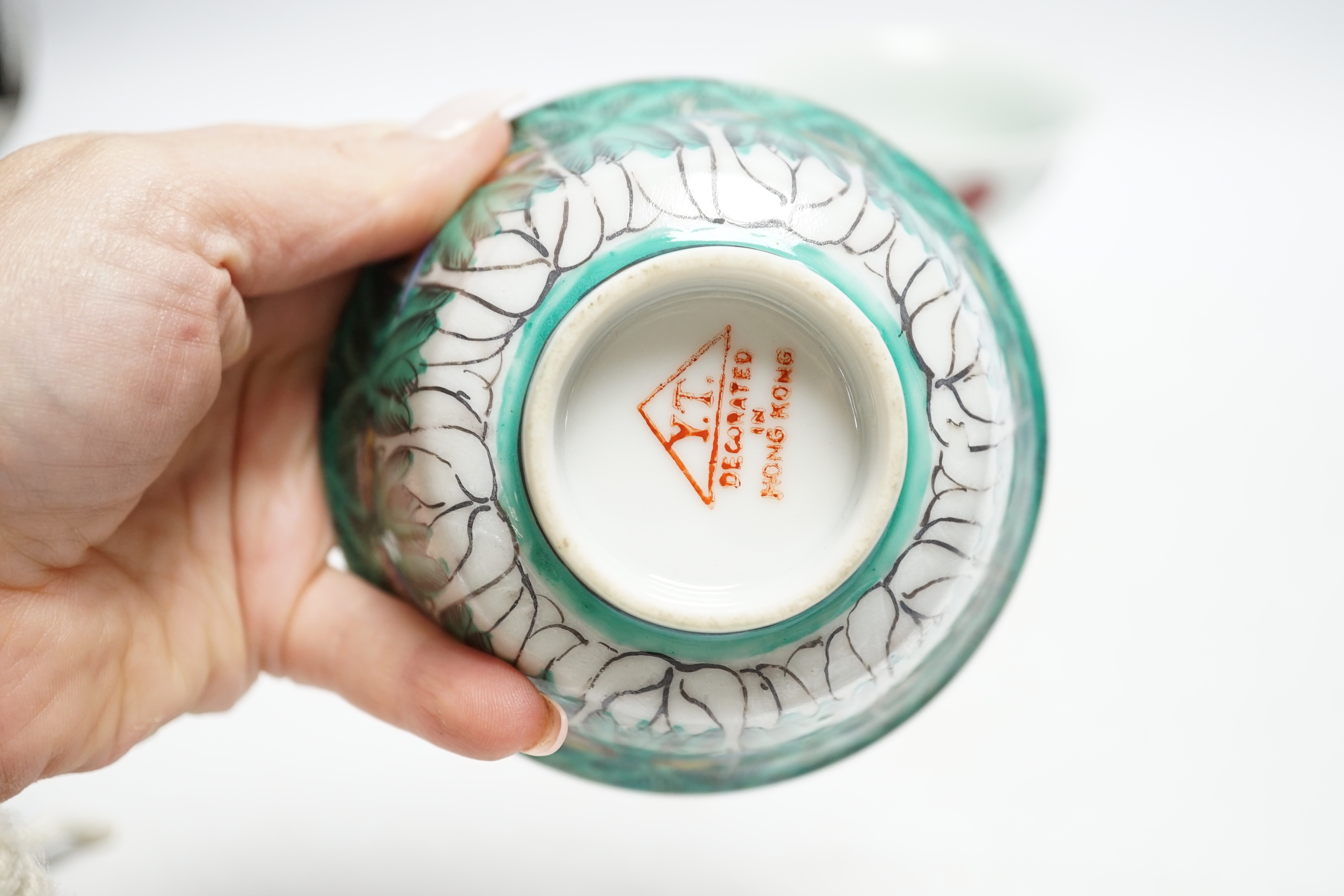 A Chinese tea bowl and stand, a white glazed horse and a pedestal bowl, tallest 9cm high